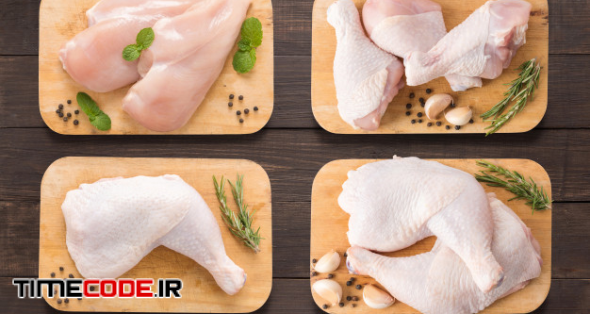 Set Raw Chicken On Cutting Board On The Wooden Background 