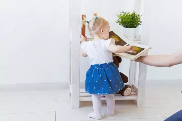 Cute Baby Girl Playing Indoors. Childhood, Infant And Children Concept. Close-up. 