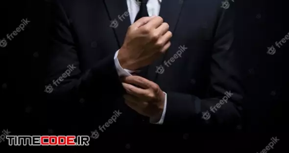 Businessman Adjusting His Cufflinks 
