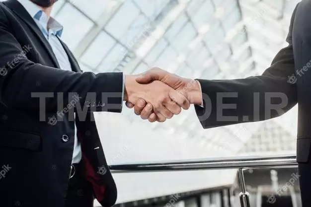 Businessmen Making Handshake In The Office 