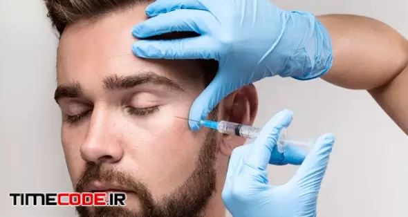 Portrait Of Man Being Injected In His Face Free Photo