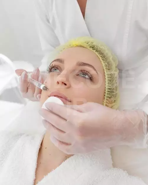 Woman At Beauty Clinic For Filler Treatment Free Photo