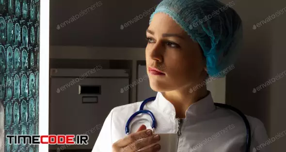 Woman Doctor Examining X-ray