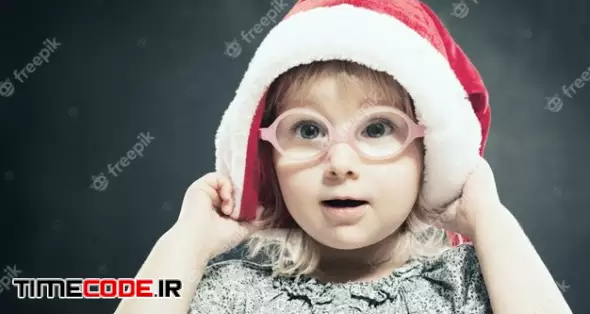 Christmas Child. Cute Little Gir In Santa Hat. 