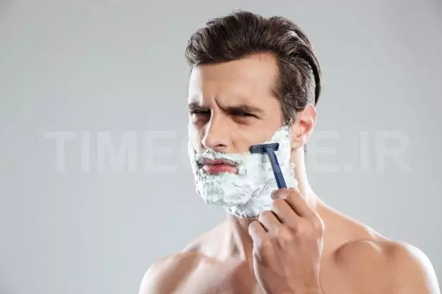 Concentrated Man Has A Shave Free Photo