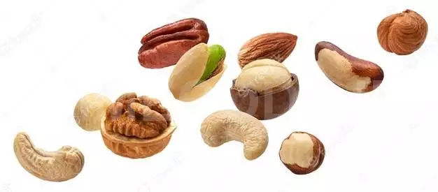 Falling Nuts Collection, Cashew, Hazelnut, Almond, Brazil Nut, Walnut, Peanut, Pistachios, Macadamia And Pecan Isolated On White Background With Clipping Path 