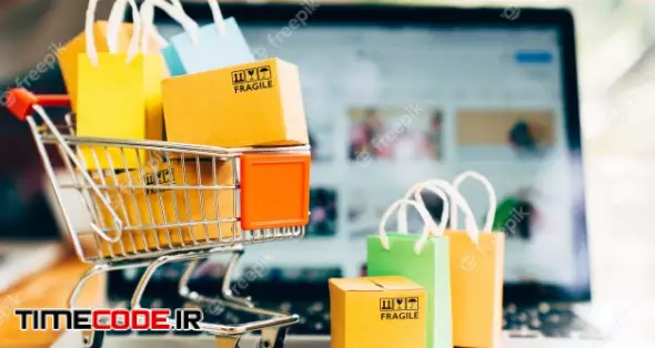 Product Package Boxes And Shopping Bag In Cart With Laptop For Online Shopping And Delivery Concept 