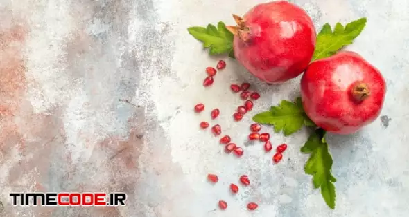 Top View Red Pomegranates Pomegranate Seeds On Nude Surface With Copy Space Free Photo