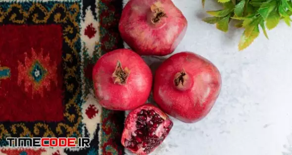 Top View Of Photo Of Fresh Sliced And Whole Pomegranate . Free Photo