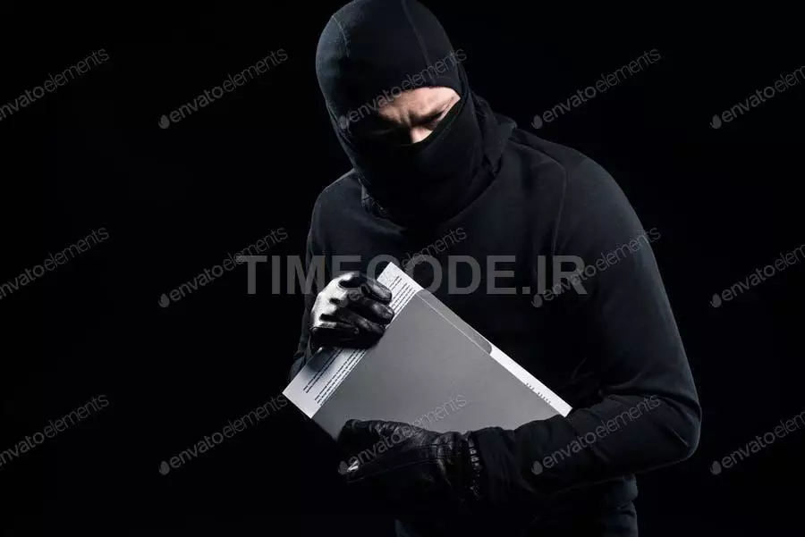 Burglar In Balaclava Holding Top Secret Documents