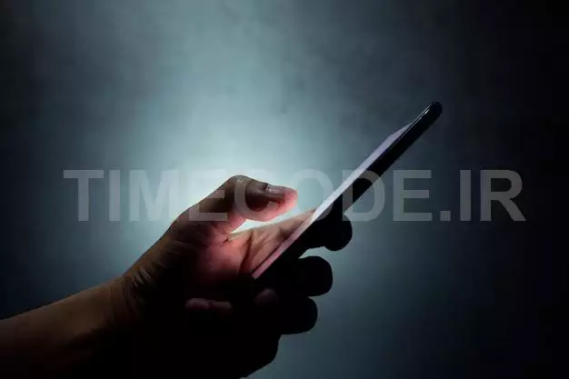 Silhouette Hand Holding And Touching A Mobile Phone Screen In The Dark Darkness 