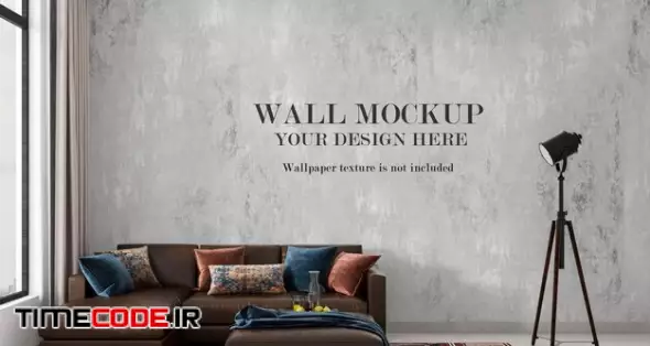 Blank Wall Mockup Behind Modern Blue Sofa 