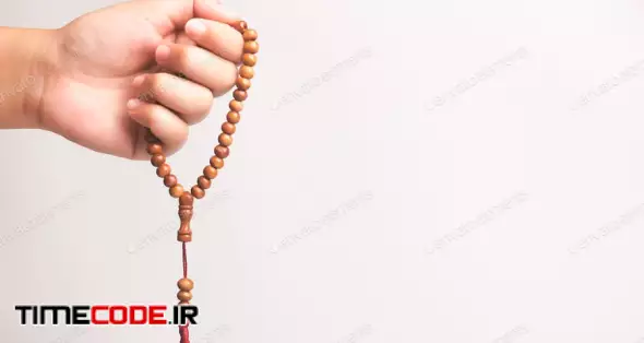Hand Of Muslim Woman Holding A Prayer Beads