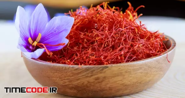 Stigmas Of Saffron And Crocus Flower In A Wooden Plate. Cooking Saffron Spices 
