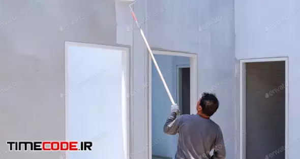 Asian Construction Worker Painting White Primer Color On Concrete Wall In House Construction Site