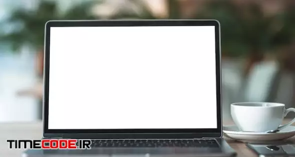 Mockup Of Laptop Computer With Empty Screen With Coffee Cup And Smartphone On Table Of The Coffee Shop Background,white Screen