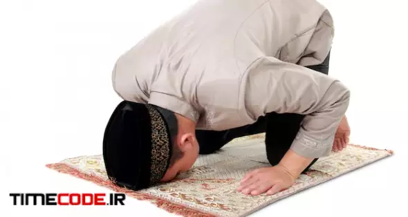 Muslim Man Praying On Carpet