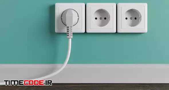 A White Electrical Outlet On The Wall In The Room. An Electric Plug With A Cable In The Socket.