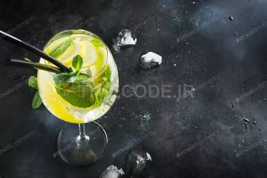 Detox Water Or Lemonade With Lemon And Mint In Glass On Black Table.