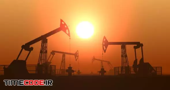 Working Oil Pump Jacks In A Desert Against Sunset Extracting Crude Oil