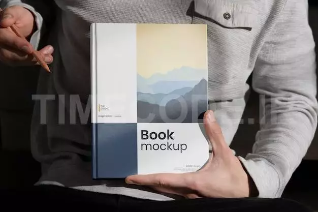 Hand Holding Book Mock-up