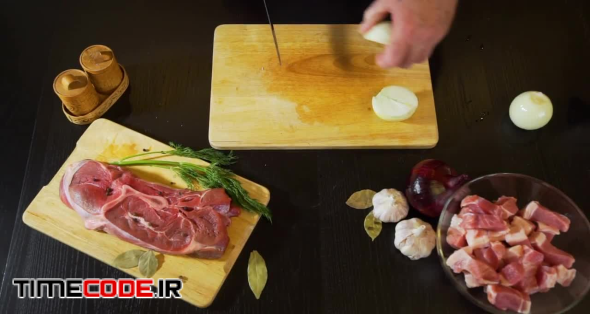 Cutting Onion On Cutting Board