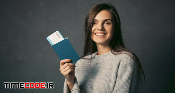 Girl Happy With Airplane Ticket