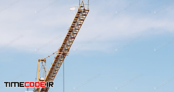 Crane And Building Construction Site On Background Of Sky