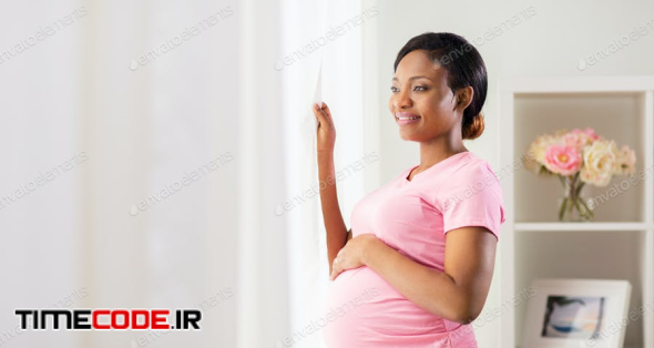 Happy Pregnant Woman With Big Belly At Home