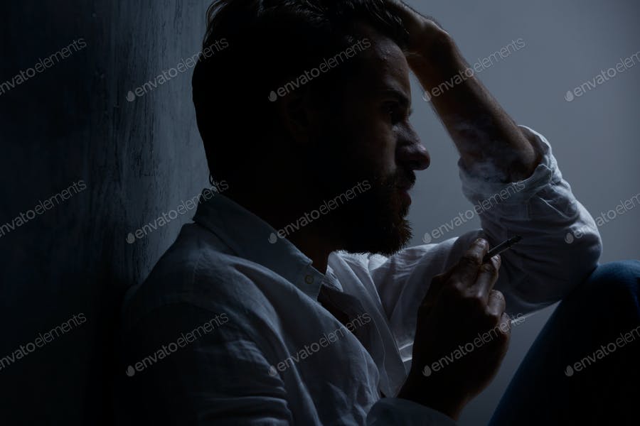 Depressed Man Smoking Cigarette
