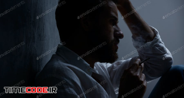 Depressed Man Smoking Cigarette
