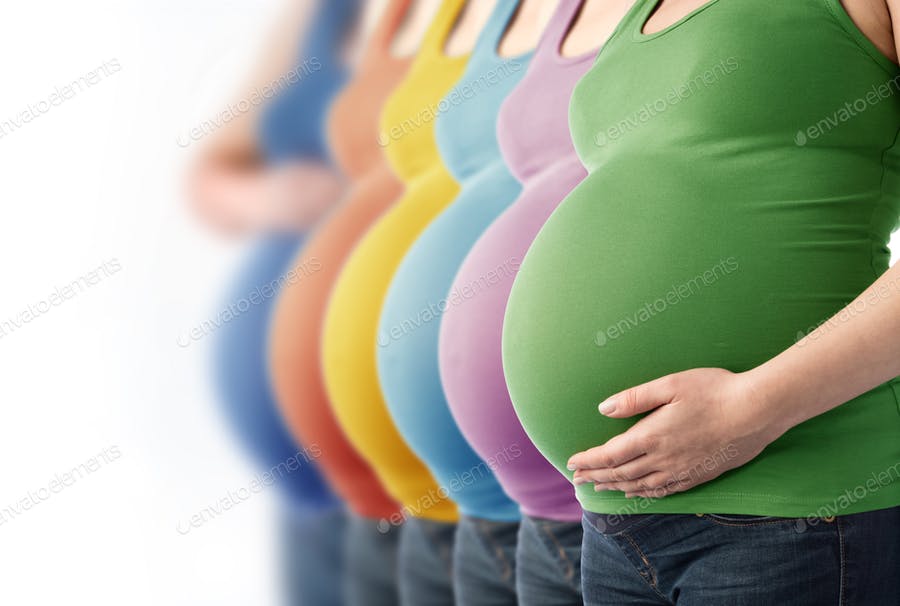 Six Pregnant Women Standing In A Row.