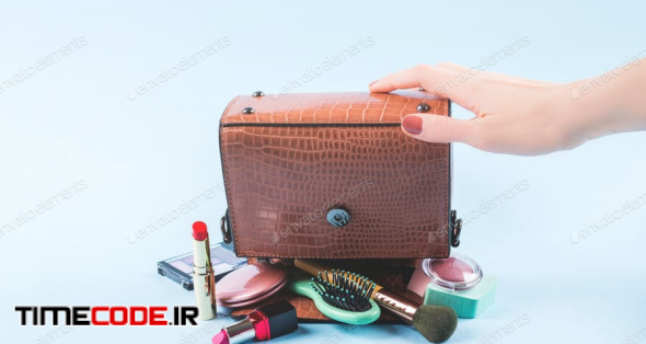 Lady Hand Bag Upside Down With Make Up Items