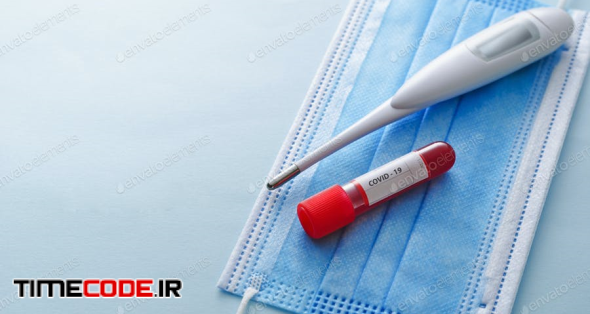 Clinical Thermometer, Tube Of Blood And Face Mask