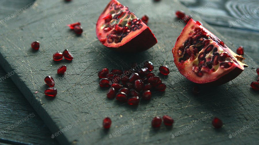 Halves Of Pomegranate With Seeds