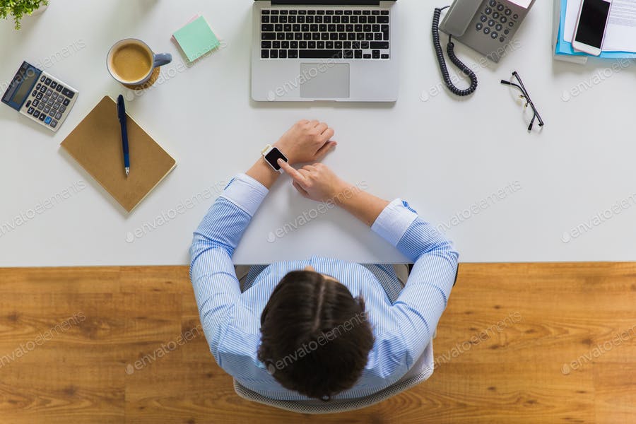 Businesswoman Working On Laptop At Office