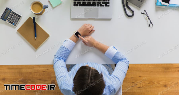 Businesswoman Working On Laptop At Office