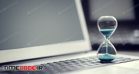 Hourglass On Laptop Computer Concept For Time Management