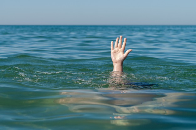 Child Hand At Sea, Need For Help. 